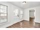Bright entryway with wood floors, natural light, and glass paneled door at 1101 Lancaster Ave, Monroe, NC 28112