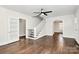 Cozy living room with hardwood floors, staircase, and access to other rooms through doorways and archways at 1101 Lancaster Ave, Monroe, NC 28112