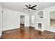 Cozy living room with a decorative fireplace, windows and modern ceiling fan at 1101 Lancaster Ave, Monroe, NC 28112