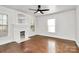 Living room showcasing a fireplace, natural lighting, and hardwood floors at 1101 Lancaster Ave, Monroe, NC 28112