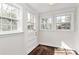 Bright sun room with natural light pouring through multiple windows and glass door at 1101 Lancaster Ave, Monroe, NC 28112