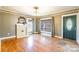 Living room featuring hardwood floors, a decorative fireplace, and abundant natural light at 112 Lentz St, Rockwell, NC 28138