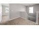 Upstairs hallway features neutral carpet and natural light at 117 Richland Ln, Mooresville, NC 28115