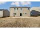 Exterior shot of back of house with sliding glass doors to patio, great natural light at 121 Edgehill Ct, Troutman, NC 28166