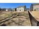 Exterior shot of back of house with sliding glass doors to patio in fenced backyard at 121 Edgehill Ct, Troutman, NC 28166