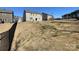 Exterior shot of back of house with sliding glass doors to patio in fenced backyard at 121 Edgehill Ct, Troutman, NC 28166