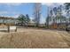 Spacious fenced-in backyard features a concrete patio and well-maintained lawn at 121 Edgehill Ct, Troutman, NC 28166