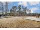 Spacious fenced-in backyard features a concrete patio and well-maintained lawn at 121 Edgehill Ct, Troutman, NC 28166