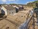 A spacious, fenced backyard with a patio, a well-manicured lawn, and some surrounding trees at 121 Edgehill Ct, Troutman, NC 28166