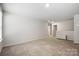 Bright bonus room with carpet, neutral walls, and adjacent bathroom at 121 Edgehill Ct, Troutman, NC 28166