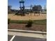 Neighborhood playground with slides, climbing structure, and safety mulch at 121 Edgehill Ct, Troutman, NC 28166