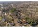 Aerial view of a neighborhood showcasing homes nestled among trees and streets, revealing the community's layout at 1216 Innis Ave, Kannapolis, NC 28081