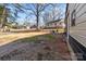 Spacious backyard with mature trees surrounding the home at 1216 Innis Ave, Kannapolis, NC 28081