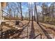 Backyard featuring stairs leading up to the house and mature trees at 1216 Innis Ave, Kannapolis, NC 28081