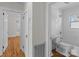 Bright bathroom features white tile, toilet, and shower-tub, creating a clean and modern look at 1216 Innis Ave, Kannapolis, NC 28081