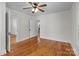 Bedroom with two doorways, hardwood floors, and ceiling fan at 1216 Innis Ave, Kannapolis, NC 28081