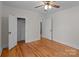 Bedroom with hardwood floors, large closet and ceiling fan at 1216 Innis Ave, Kannapolis, NC 28081