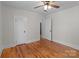 Bedroom with hardwood floors, two doorways, and ceiling fan at 1216 Innis Ave, Kannapolis, NC 28081