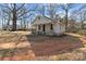 Charming home exterior featuring a front porch and mature trees at 1216 Innis Ave, Kannapolis, NC 28081
