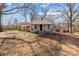 Inviting home with covered parking, a classic front porch, and a spacious yard, blending comfort and convenience at 1216 Innis Ave, Kannapolis, NC 28081