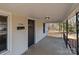 Charming covered front porch, featuring a black front door and house number at 1216 Innis Ave, Kannapolis, NC 28081