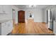 Open-concept living space with stainless fridge and hardwood floors at 1216 Innis Ave, Kannapolis, NC 28081