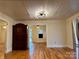 An open living room featuring hardwood floors and modern light fixture that is perfect for entertaining guests at 1216 Innis Ave, Kannapolis, NC 28081