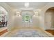 Grand foyer with designer rug, decorative sconces, and elegant glass paneled front door and sidelights at 12702 Overlook Mountain Dr, Charlotte, NC 28216
