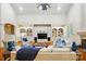Elegant living room featuring built-in shelving, hardwood floors, large windows, and comfortable seating at 12702 Overlook Mountain Dr, Charlotte, NC 28216