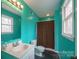 Bathroom featuring blue walls, sink, and dark shower curtain at 1443 Greenwood Rd, Lincolnton, NC 28092