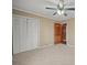 Bedroom with tan walls, carpet, closet, and access to the ensuite bathroom at 1443 Greenwood Rd, Lincolnton, NC 28092