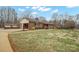 Lovely brick ranch-style home with a side carport and well-maintained lawn at 1443 Greenwood Rd, Lincolnton, NC 28092