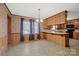 Charming kitchen and dining area featuring oak cabinetry and breakfast bar at 1443 Greenwood Rd, Lincolnton, NC 28092