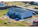 Rear aerial showcasing the home, back deck, yard and backyard basketball court and fencing at 1868 Ellick Dr, Newton, NC 28658