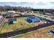 Aerial view of fenced backyard with gazebo, shed, and multiple cars parked at 1868 Ellick Dr, Newton, NC 28658