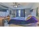 Well lit bedroom, with a large bed, dresser, closet and a big window at 1868 Ellick Dr, Newton, NC 28658