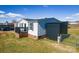 Exterior view of a home with vinyl siding and an outbuilding in the backyard at 1868 Ellick Dr, Newton, NC 28658