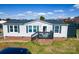 Charming single-story home featuring white siding, black shutters, and a cozy front porch at 1868 Ellick Dr, Newton, NC 28658