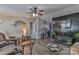 Cozy living room with wood-look flooring, ceiling fan and entertainment center at 1868 Ellick Dr, Newton, NC 28658