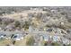 Scenic aerial view of a neighborhood showcasing tree-lined streets and a mix of single-Gathering homes at 206 Mcconnell St, Clover, SC 29710