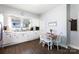 Bright kitchen featuring a dining table with white cabinets and modern appliances at 206 Mcconnell St, Clover, SC 29710