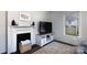 Cozy living room showcasing a decorative fireplace and stylish decor, creating a warm ambiance at 206 Mcconnell St, Clover, SC 29710