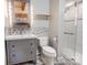 Bright bathroom featuring a modern vanity and tiled shower at 2139 Peninsula Dr, Clover, SC 29710