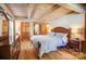 Spacious bedroom features a wooden ceiling, hardwood floors and matching dresser at 2139 Peninsula Dr, Clover, SC 29710