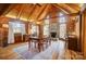 Sunlit dining room featuring wood floors, wood beams and a cozy fireplace at 2139 Peninsula Dr, Clover, SC 29710