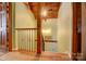 Stairwell features wood trim and decorative iron handrail at 2139 Peninsula Dr, Clover, SC 29710