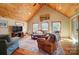 Bright and spacious living room with comfortable seating, area rug, and three large windows at 2139 Peninsula Dr, Clover, SC 29710