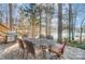 Outdoor dining on a stone patio with a lake view, grill, and a table with six chairs at 2139 Peninsula Dr, Clover, SC 29710