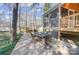 Rear patio with outdoor dining and a screened porch on this beautiful lake property at 2139 Peninsula Dr, Clover, SC 29710
