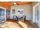 A screened porch with brown wood floors, furniture, decor, and a view of nature at 2139 Peninsula Dr, Clover, SC 29710